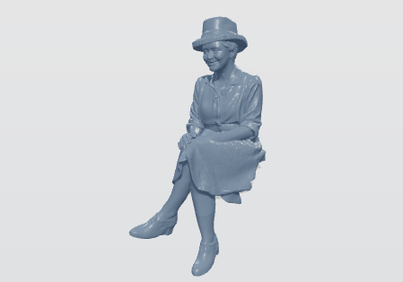 Female figure seated wearing a hat